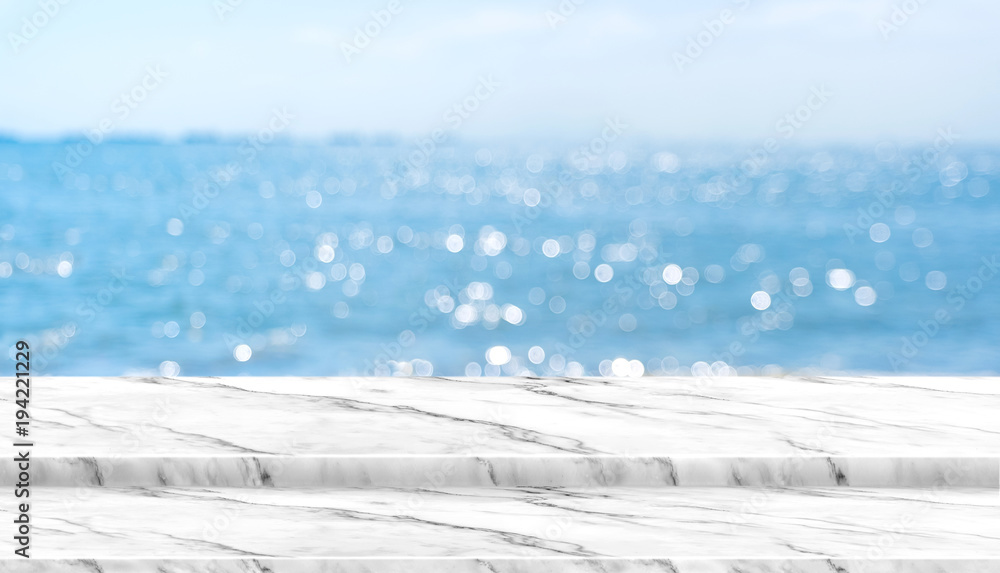 Aufkleber empty white marble table top with blur blue sky and sea boekh background in sunny day,mock up templa