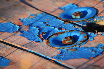 Naklejka premium Old Blue Paint and Rusty Bolts Texture