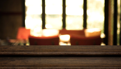 Empty step dark wood table top food stand with blur cafe restaurant background bokeh light,Mock up for product display or montage of design,Banner for advertise on online media,business presentation.