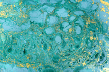 Marble abstract acrylic background. Nature blue marbling artwork texture. Golden glitter.