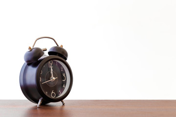 Closeup object clock alarm on white background,copy space