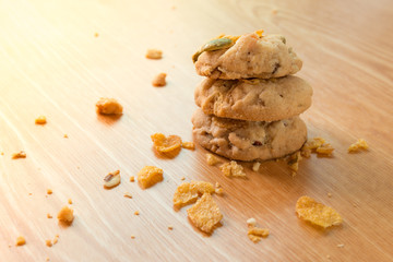 Cereal cookies on a wooden table and sun rise