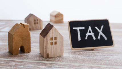 Houses with tax sign - obrazy, fototapety, plakaty
