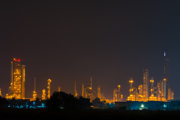 Fototapeta na wymiar Night view over petroleum power plant industrial background