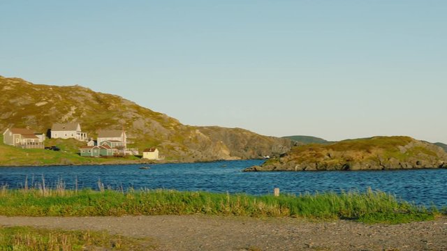 Houses and Iceberg in ocean harbor at twillingate newfoundland