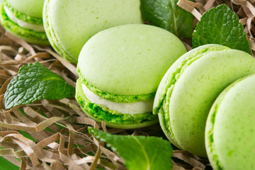 in the packaging substrate lies souffle with apple flavor with mint, background macaron