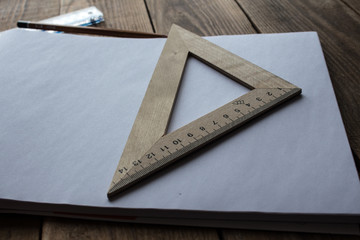 pencils and ruler near paper