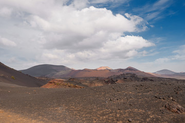 Fototapeta na wymiar Amazing volcanic landscape and lava desert in Timanfaya national park, Lanzarote, canary islands, Spain.