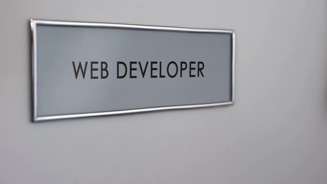 Web developer office door, hand knocking closeup, software program coding
