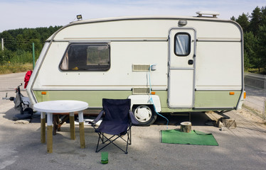 Standard car tourist trailer in summer camping
