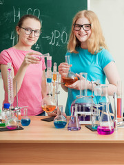 two girls doing chemical experiments