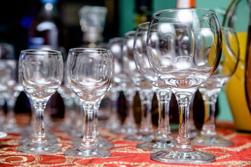 Glass glasses stand on a buffet table 
