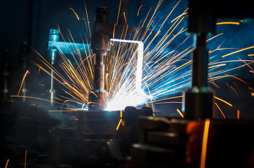 Welding robots movement in a car factory