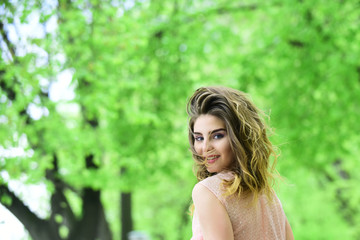 Naklejka premium Sensual woman smile in spring park