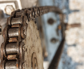 Old rusty gear wheel with chain ratchet drive