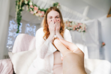 Man giving ring to woman