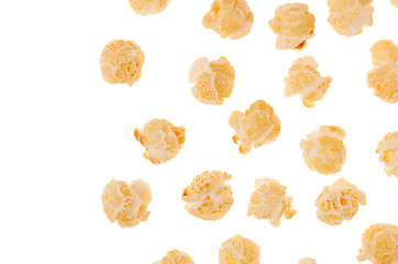 Popcorn flakes as decorative border with flying corn, isolated, with copy space.