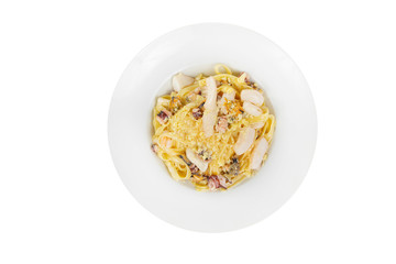 Pasta, noodles with seafood, decorated with cheese. Isolated white view from above Serving a meal in a cafe, restaurant.