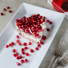 Crazy salad of pomegranate, sausage and chinese cabbage.