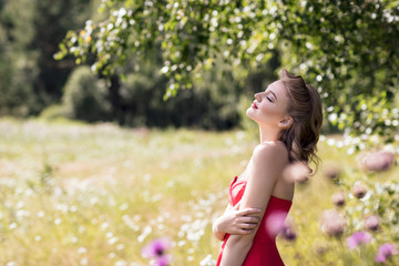 Young woman in retro style in summer park.