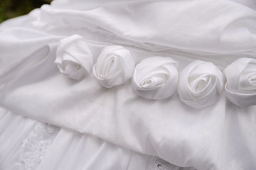 detail of decorating white wedding dresses for the bride
