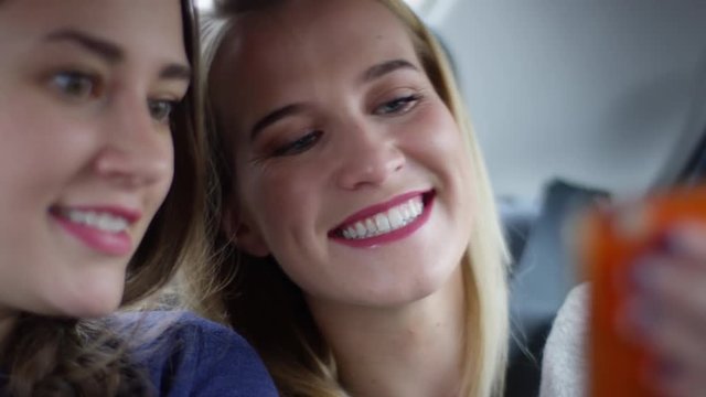 Closeup Of Happy Young Women Taking A Selfie Together In Moving Car - Shot On Red Scarlet-W Dragon In 4k/Slow Motion