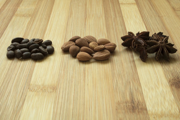 Almonds Illicium coffee seeds on a wooden board