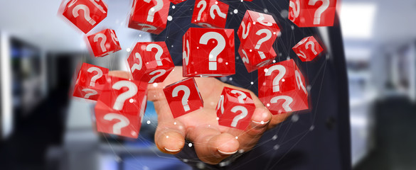 Businessman using cubes with 3D rendering question marks