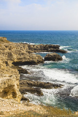 Fototapeta na wymiar The sea landscape of Cape Tarkhankut, Crimea peninsula. Blue water and yellow rocks. Bright sunny background or wallpaper