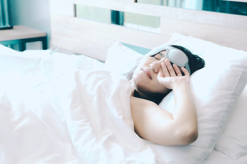 women sleep in white pillow on bed, after waking up in the sweet morning