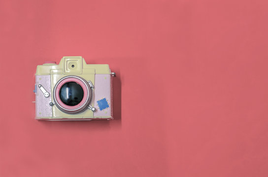 yellow pink vintage camera on red background, copy space. wedding photography, I love photography concept