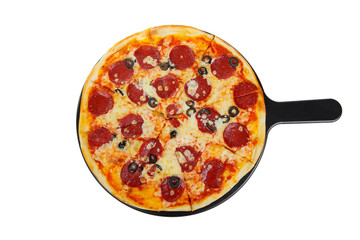 Pizza whole round on a black tray, blackboard, cut into pieces, on a white isolated background. Fast food in a pizzeria, a floury cheese product. View from above