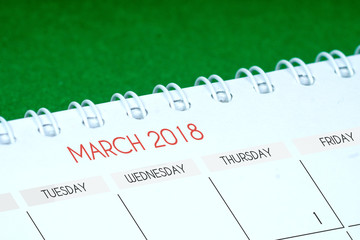 march 2018 calendar on green table
