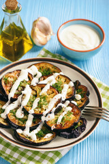 Fried eggplants with garlic and yogurt sauce.