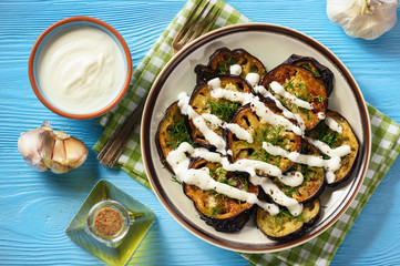 Fried eggplants with garlic and yogurt sauce.