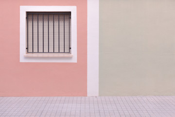 Obraz na płótnie Canvas City background. Window on colorful wall and pavement
