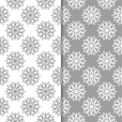 White and gray floral backgrounds. Set of seamless patterns