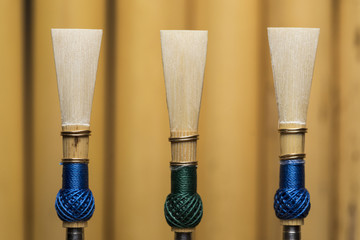 Basson reed on wood cylinder background