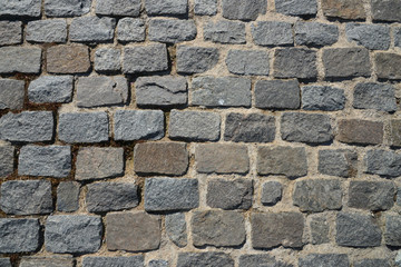 Old cobblestone pavement close-up.