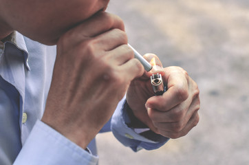 Close up Image of a man Lighting a cigarette