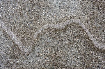 Fototapeta na wymiar abstract line pattern on sand beach