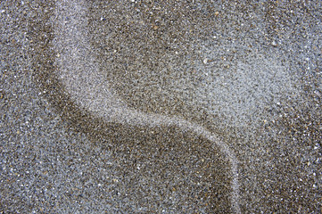abstract line pattern on sand beach
