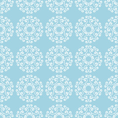 White flowers on blue background. Ornamental seamless pattern