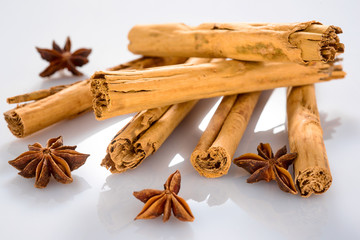 group of cinnamon sticks with star anice isolated in a white background