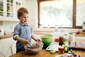 Cute child learning to become a chef