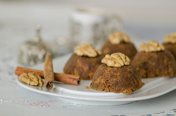 flour halva with walnut and cinnamon on the white serving