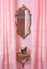 Classic framed mirror in pink interior