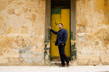 The man walks on ancient streets of Malta