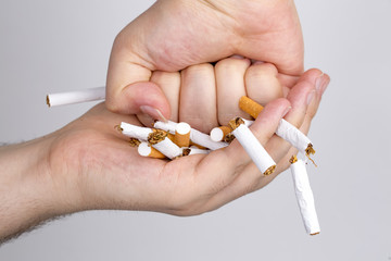 Broken cigarette on white background. healthy concpet
