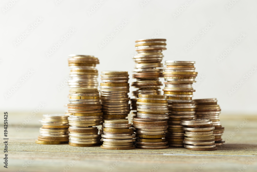 Wall mural coins stack on wooden table